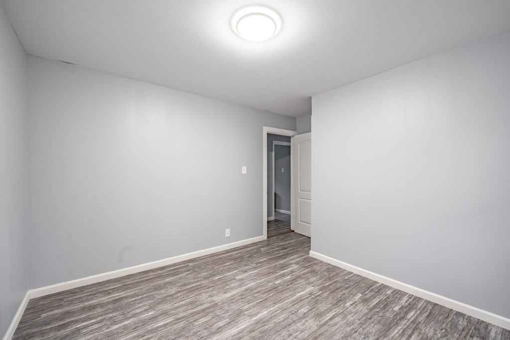 21 Wilbraham Road Monson, MA 01057 - Photo 22 of 26 an empty room with wooden floor and windows