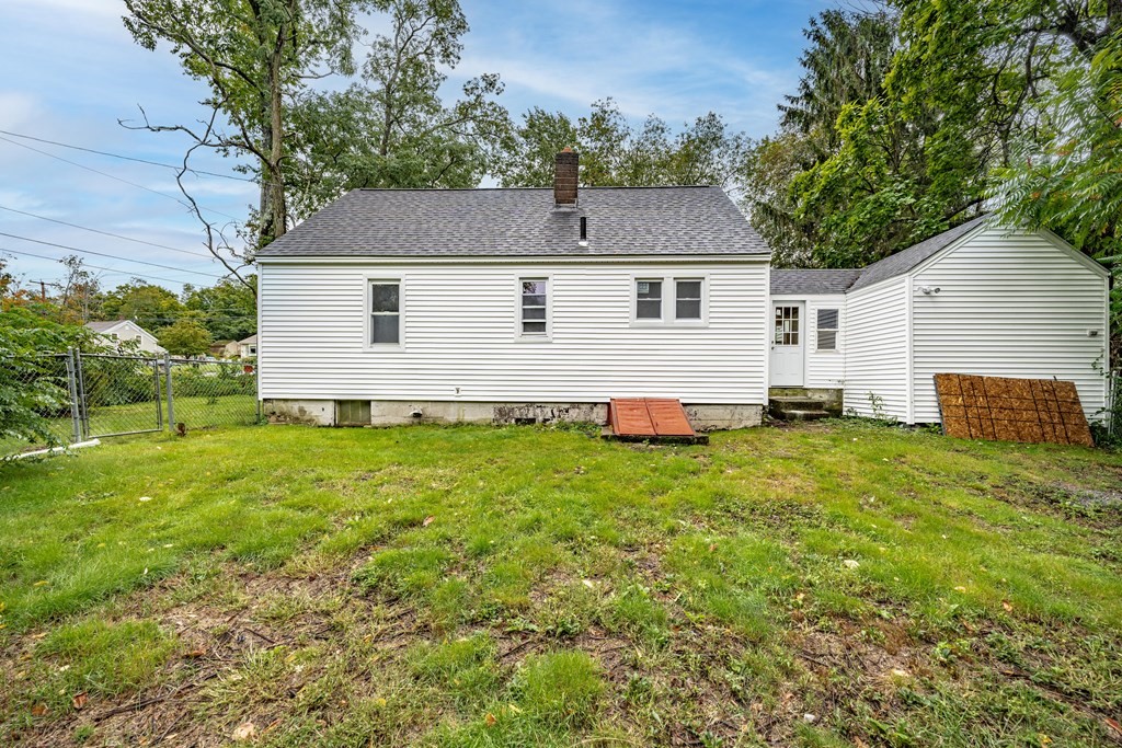 21 Wilbraham Road Monson, MA 01057 - Photo 24 of 26 a front view of house with yard and trees in the background