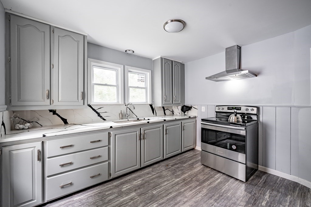 21 Wilbraham Road Monson, MA 01057 - Photo 3 of 26 a kitchen with a stove oven and sink