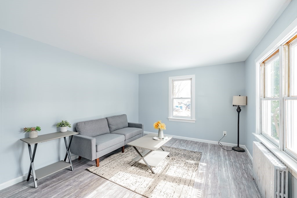 21 Wilbraham Road Monson, MA 01057 - Photo 6 of 26 a living room with furniture and a window