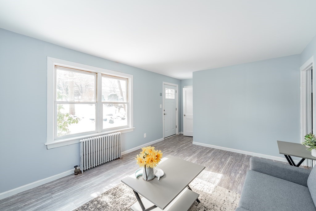21 Wilbraham Road Monson, MA 01057 - Photo 8 of 26 a living room with furniture and a window