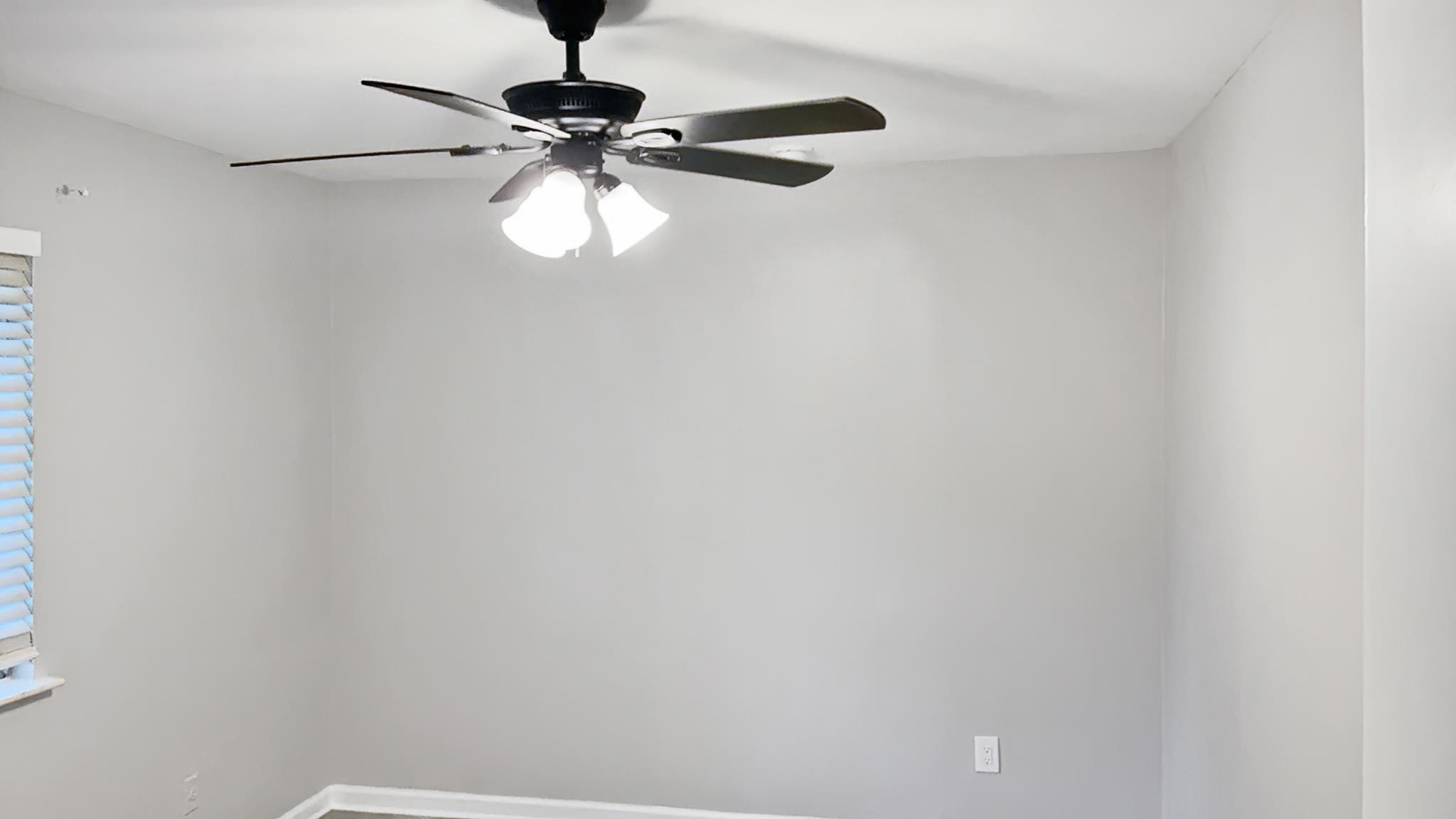 335 Homeville Road Collierville, TN 38017 - Photo 6 of 11 Recessed lighting complemented by a ceiling fan with integrated illumination, light gray wall finish, white trim, and wood-finish flooring