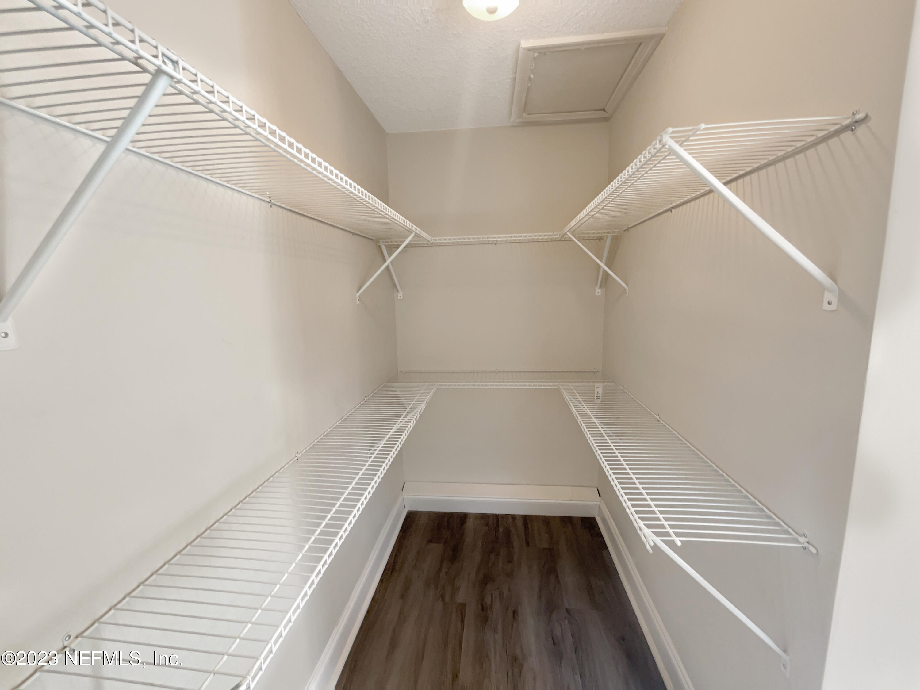 1820 Leonid Road Jacksonville, FL 32218 - Photo 14 of 21 a view of closet with wooden floor