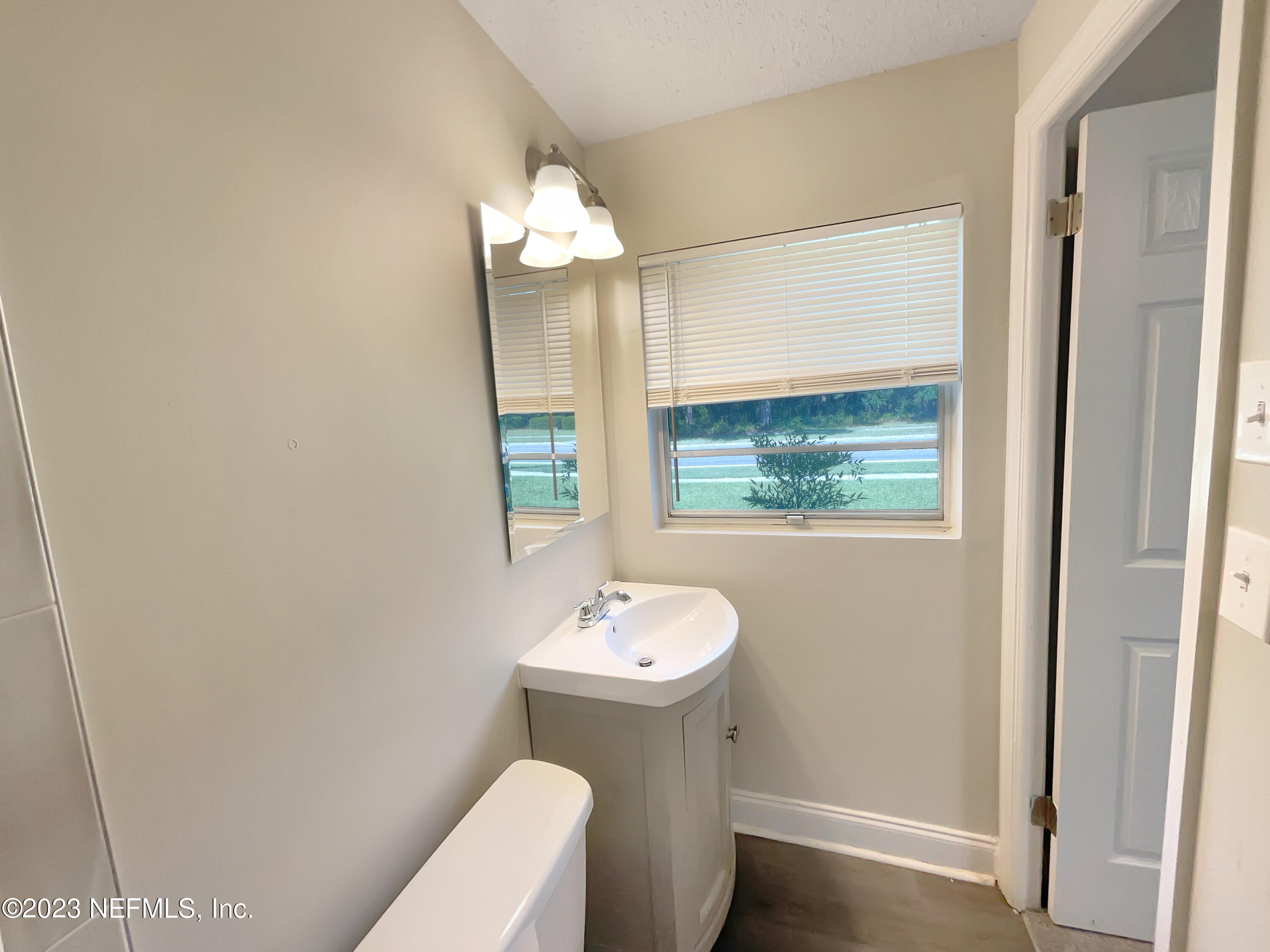 1820 Leonid Road Jacksonville, FL 32218 - Photo 16 of 21 a bathroom with a sink and a mirror