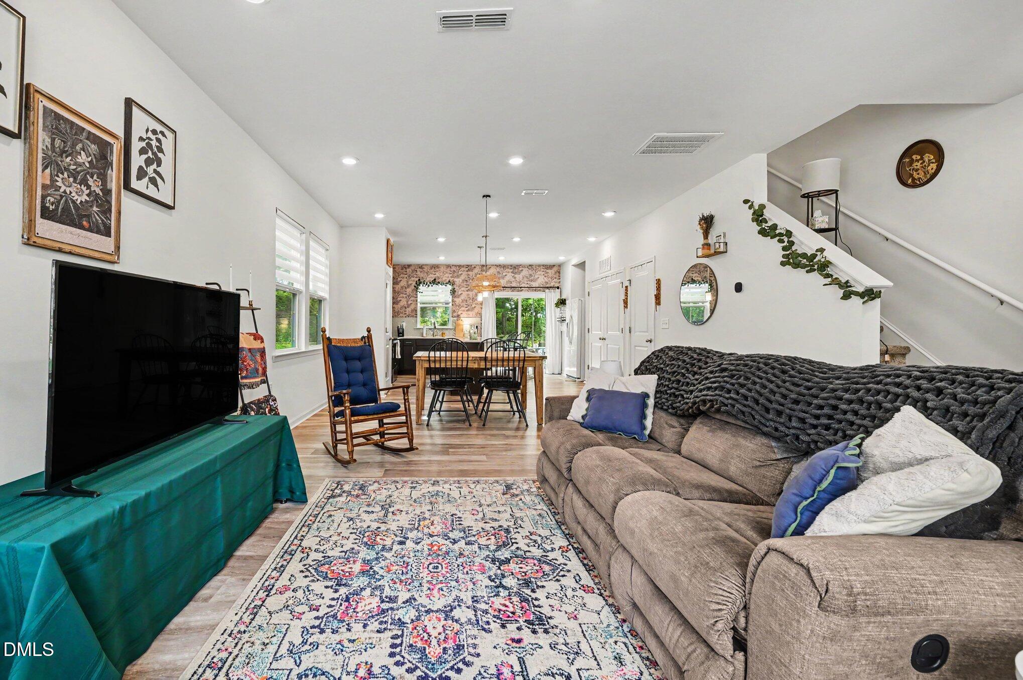 574 Hacksaw Trail Raleigh, NC 27610 - Photo 8 of 28 a living room with furniture and a flat screen tv