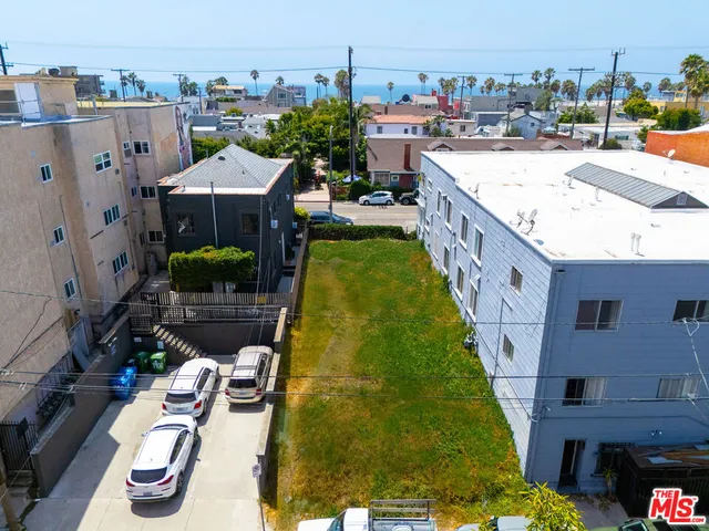 a terrace with outdoor seating and city view