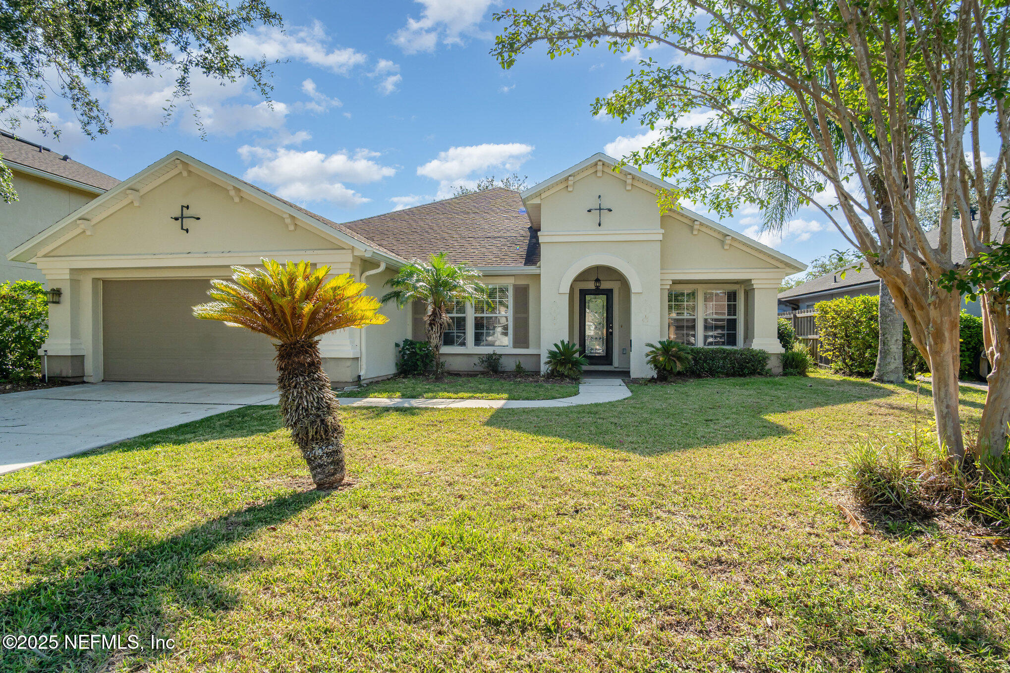 a front view of a house with garden