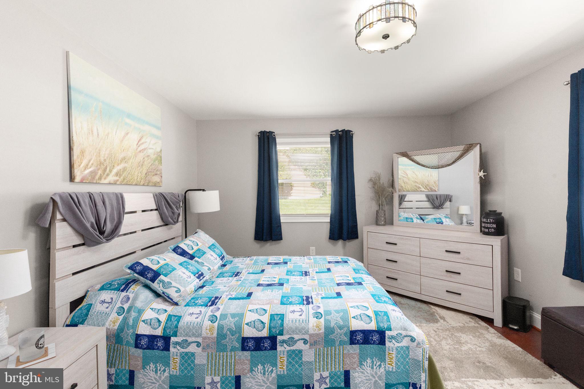 814 Foxwell Road Joppa, MD 21085 - Photo 13 of 21 a bedroom with a bed and a chandelier