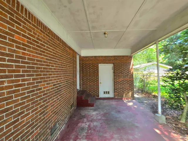 a view of house with backyard space and garden