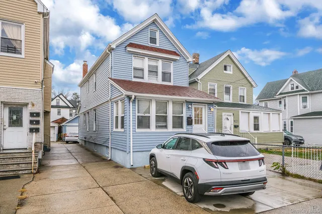 a car parked in front of a house