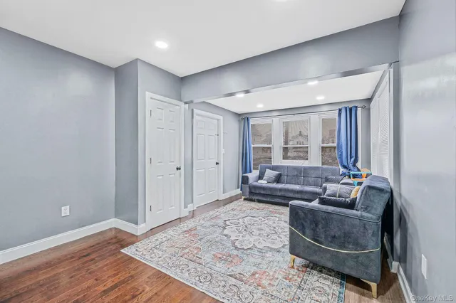 a living room with furniture and a rug