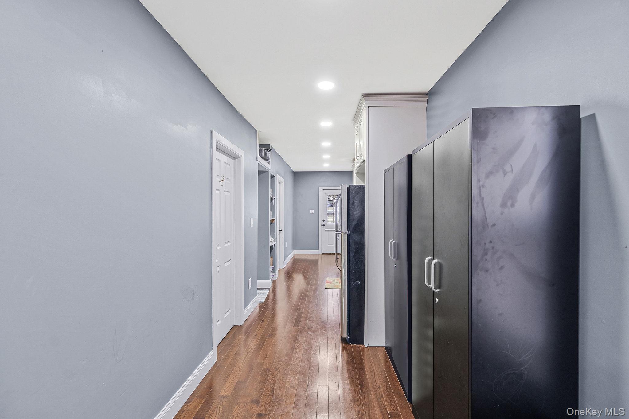 101-19 Lefferts Boulevard Queens, NY 11419 - Photo 8 of 15 a view of hallway with wooden floor