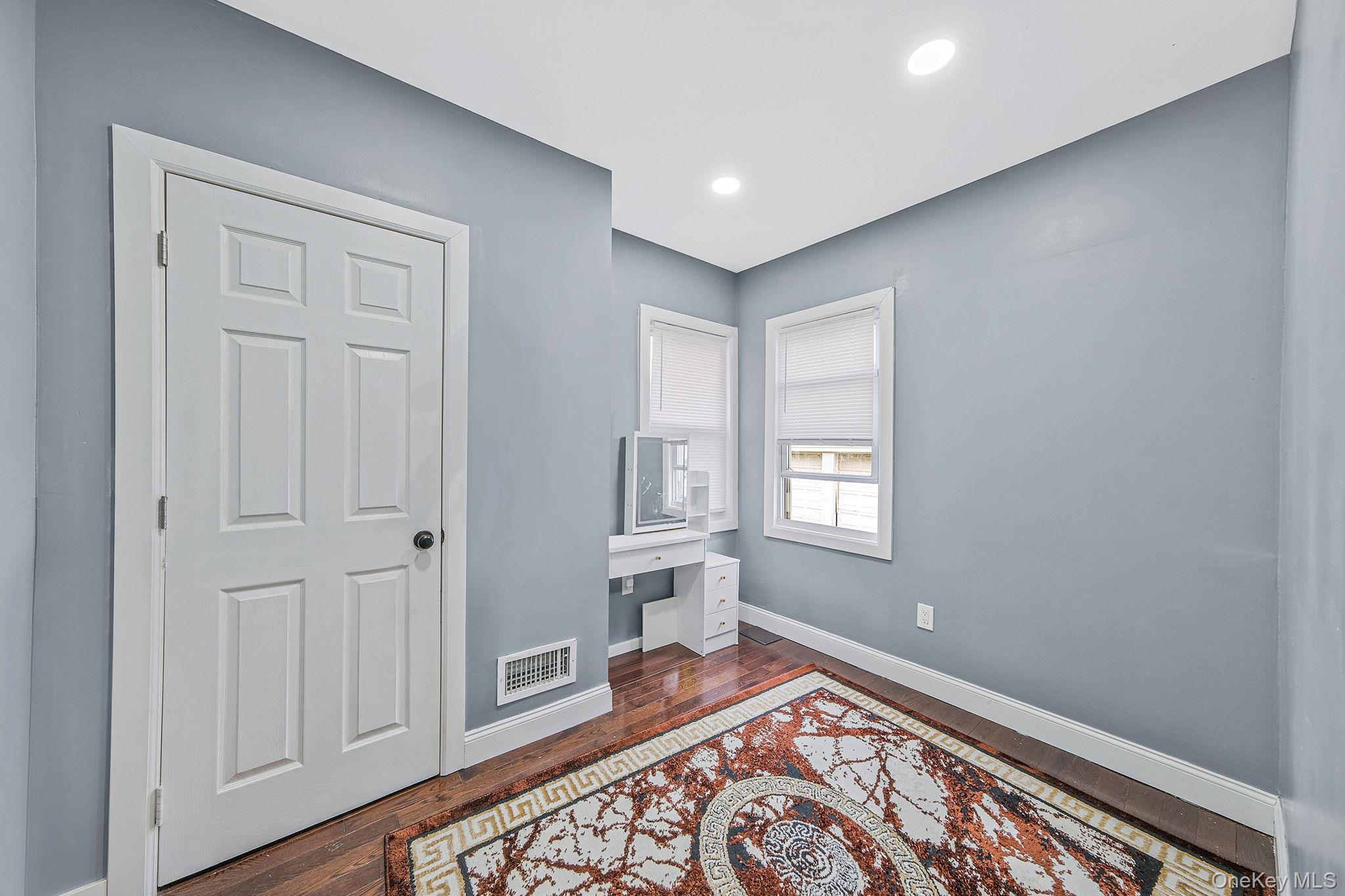 101-19 Lefferts Boulevard Queens, NY 11419 - Photo 9 of 15 a view of an empty room and window