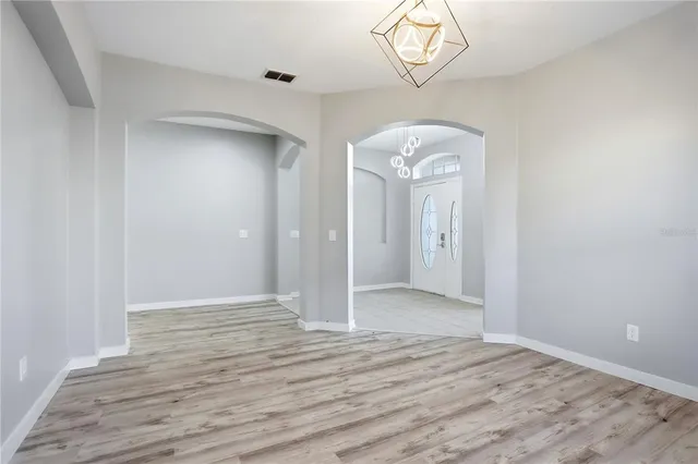 a view of a kitchen from the hallway