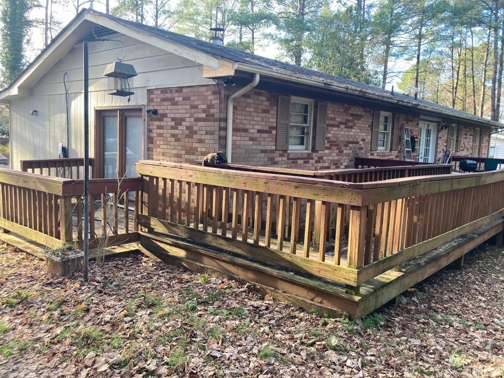 11512 Hickory Grove Church Road Raleigh, NC 27613 - Photo 14 of 17 a view of a house with wooden fence