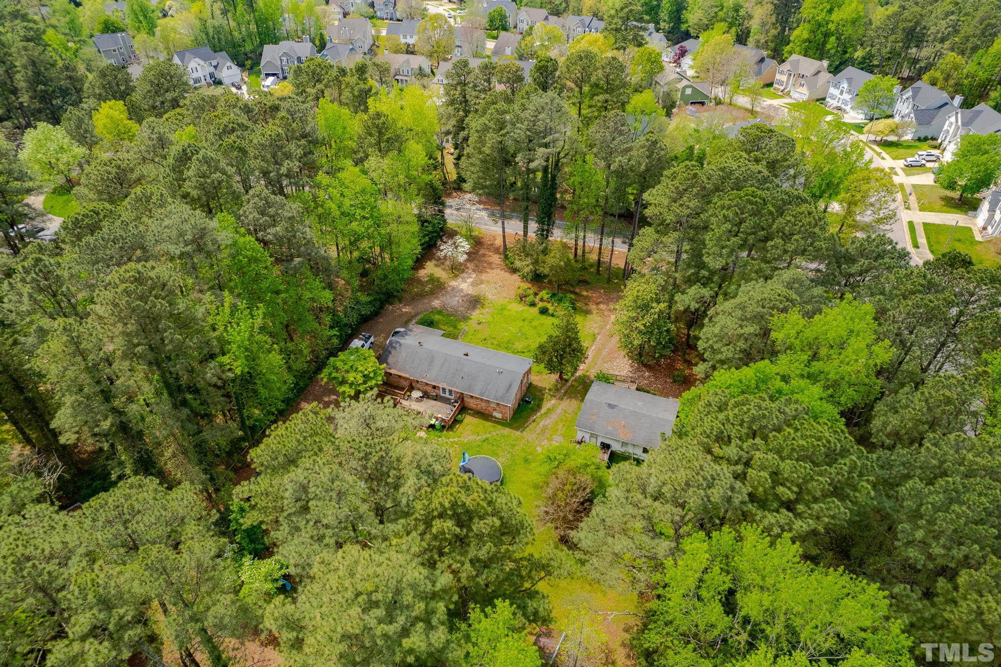 11512 Hickory Grove Church Road Raleigh, NC 27613 - Photo 7 of 17 an aerial view of residential house with outdoor space and trees all around