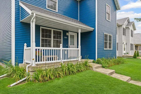 a front view of a house with a garden