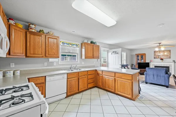a kitchen with a sink stove and cabinets