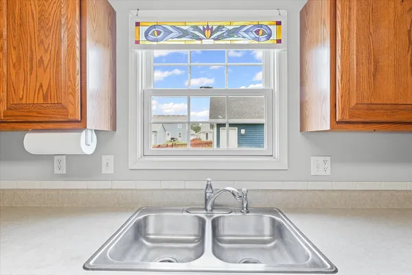 a bathroom with a sink and a window