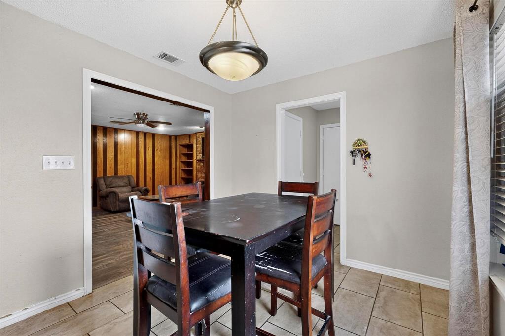 865 Harlan Road Combine, TX 75159 - Photo 14 of 38 a view of a dining room with furniture and window