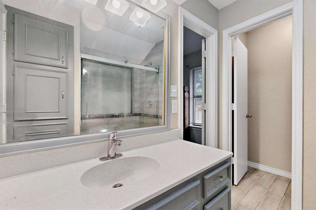 865 Harlan Road Combine, TX 75159 - Photo 20 of 38 a bathroom with a sink and a mirror