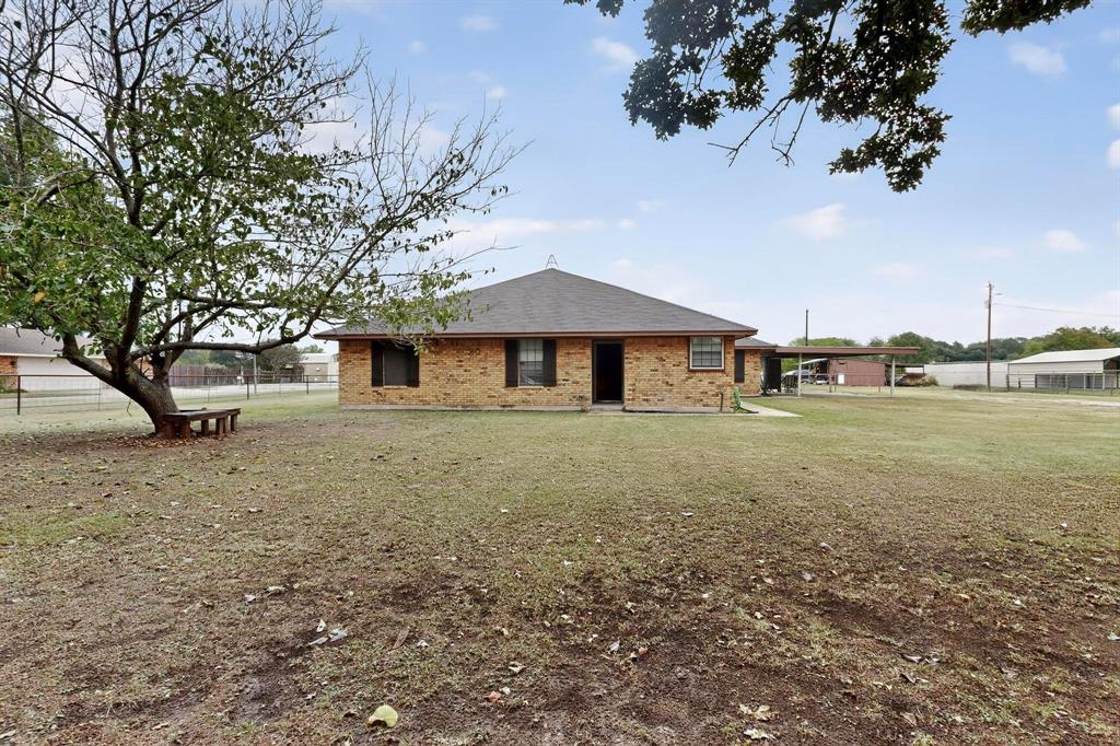 865 Harlan Road Combine, TX 75159 - Photo 2 of 38 a front view of a house with garden