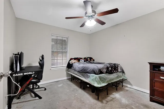 a bedroom with a bed and a dresser