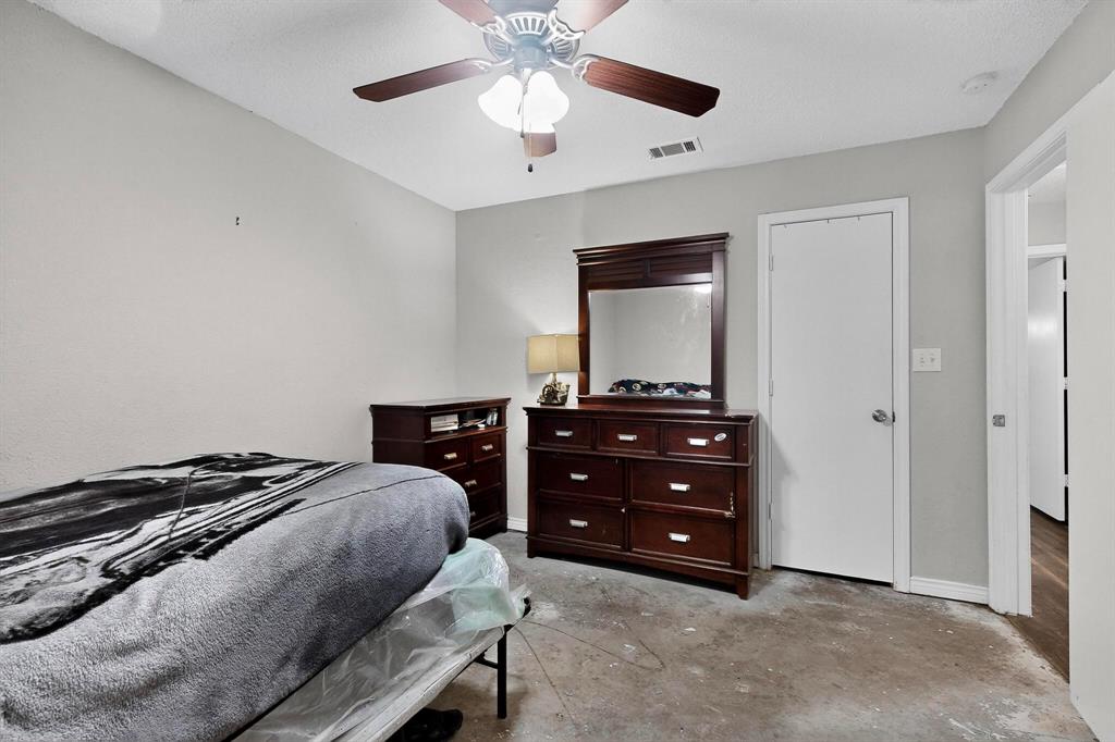 865 Harlan Road Combine, TX 75159 - Photo 23 of 38 a bedroom with a bed and a dresser