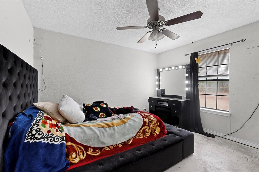 865 Harlan Road Combine, TX 75159 - Photo 26 of 38 a bedroom with bed and window