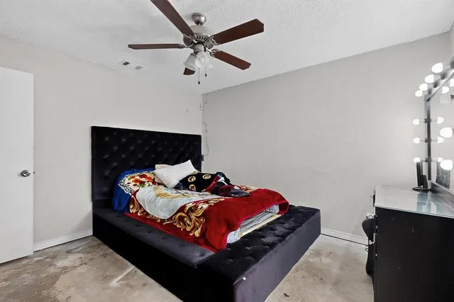 a view of a workspace with furniture and a flat screen tv