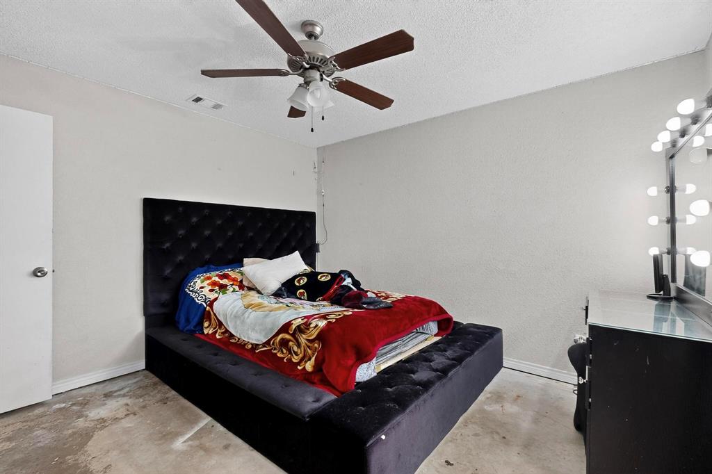 865 Harlan Road Combine, TX 75159 - Photo 27 of 38 a bed room with a bed and a television