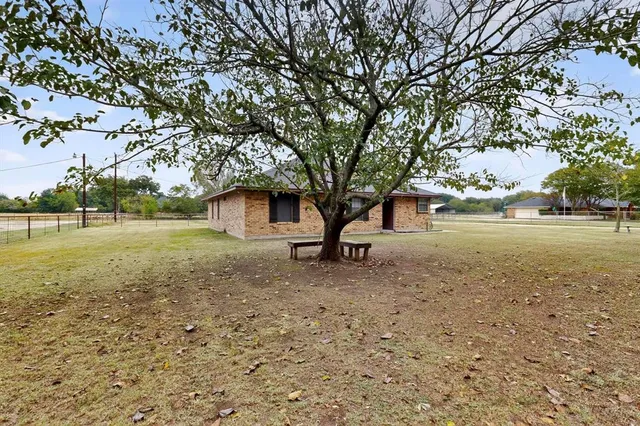 a backyard of a house with lots of green space
