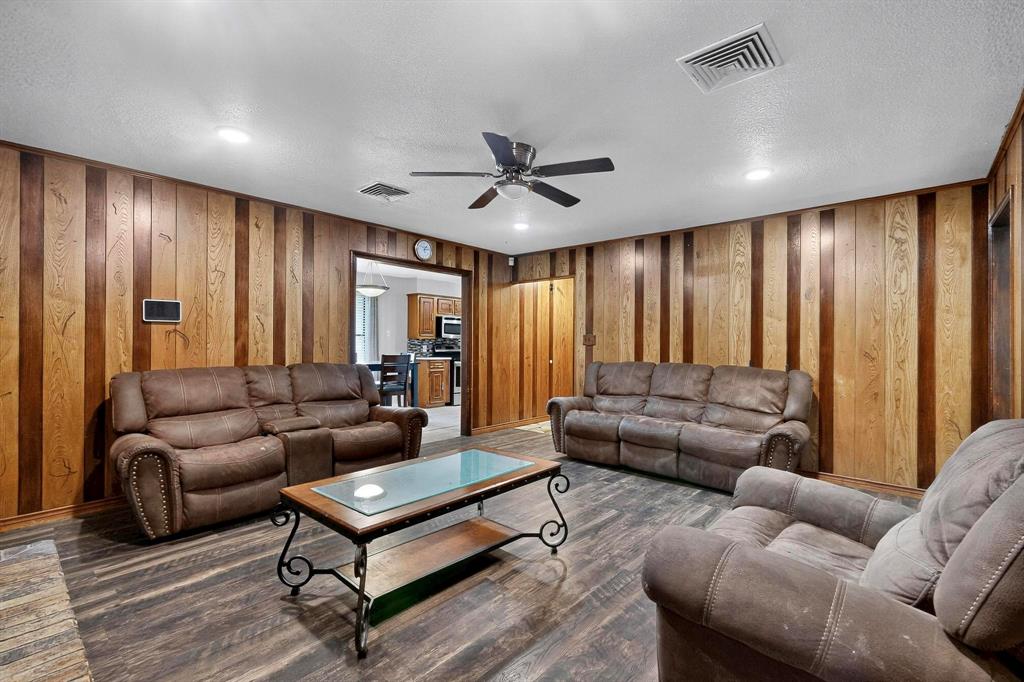 865 Harlan Road Combine, TX 75159 - Photo 6 of 38 a living room with furniture and a ceiling fan