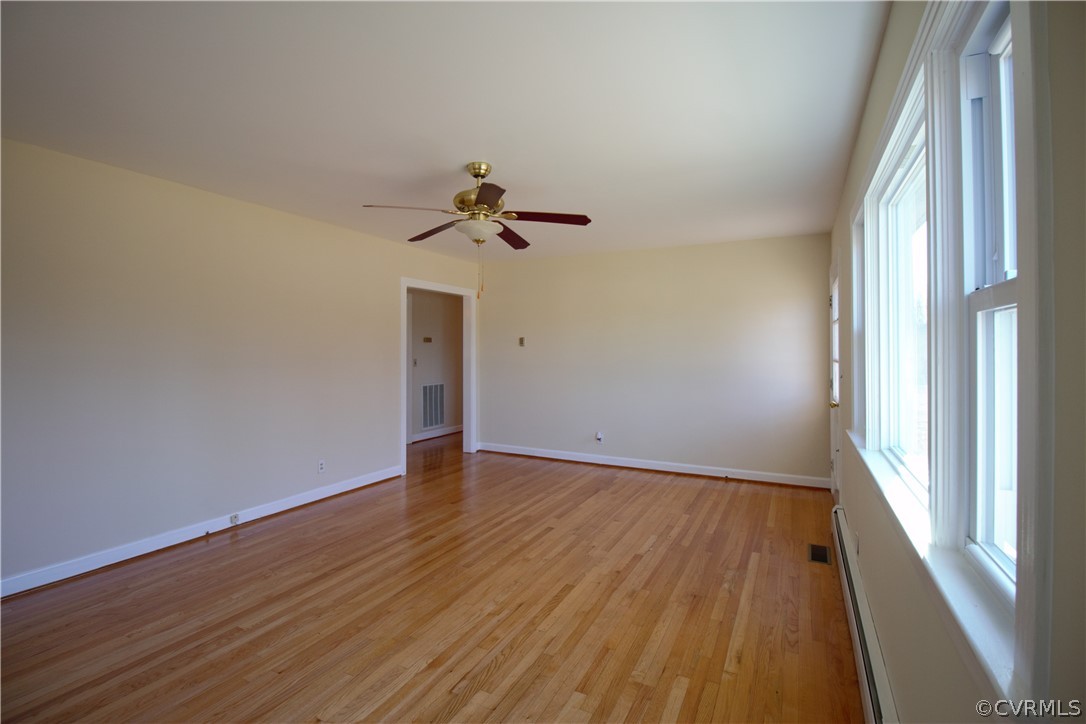 9893 Francisco Road Farmville, VA 23901 - Photo 11 of 26 an empty room with wooden floor and windows