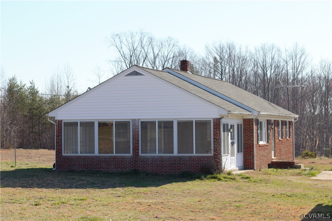9893 Francisco Road Farmville, VA 23901 - Photo 2 of 26 a house that has a large window in it with large trees