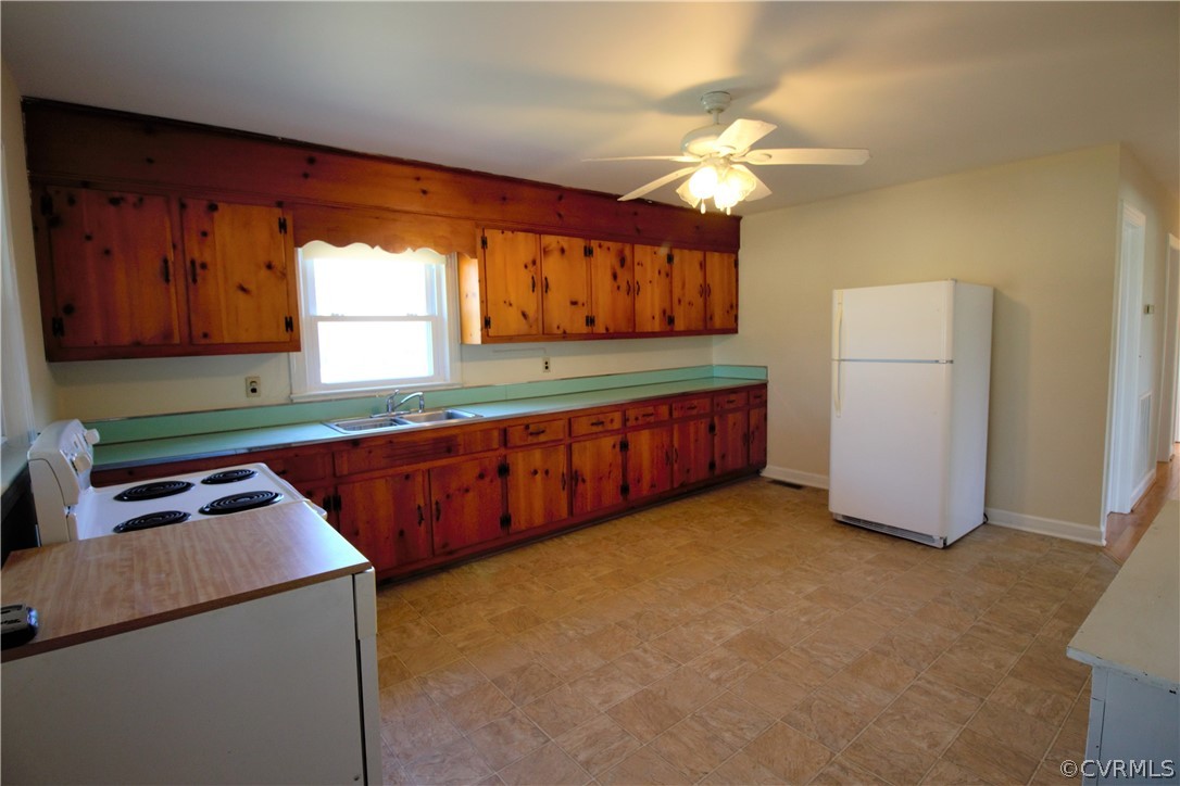 9893 Francisco Road Farmville, VA 23901 - Photo 8 of 26 a kitchen with stainless steel appliances granite countertop a stove a sink dishwasher and a refrigerator with wooden cabinets