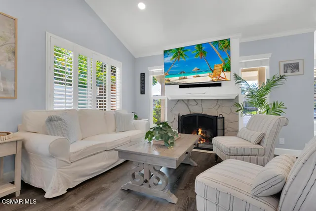 a bathroom with a granite countertop sink a mirror and a shower