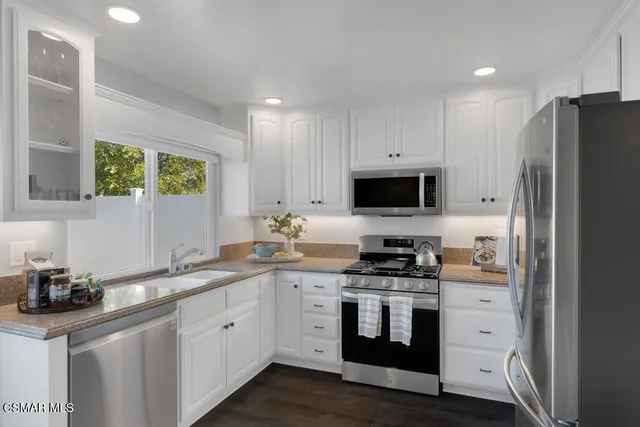 a bathroom with a double vanity sink and mirror