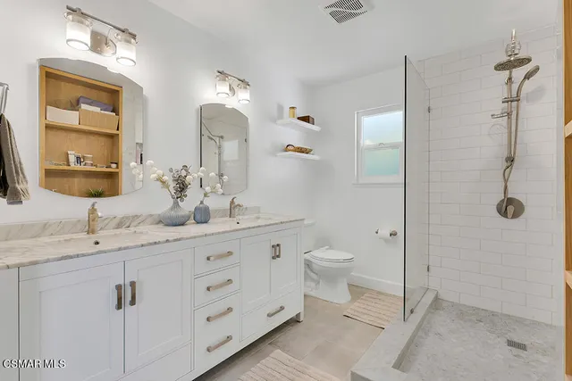 a bedroom with a bed furniture and decor