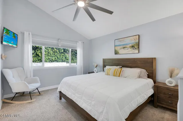 a bathroom with a granite countertop sink and a toilet
