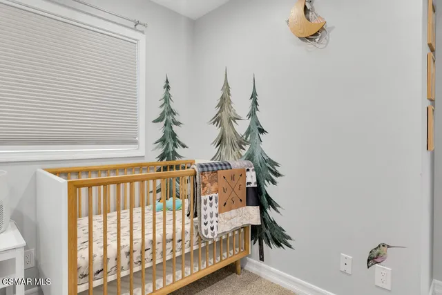 an aerial view of a house with a yard basket ball court and outdoor seating