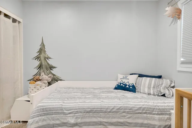 a view of a patio with table and chairs and potted plants