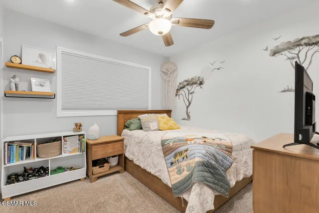 an aerial view of residential houses with outdoor space and river