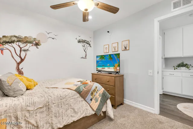 a view of a patio with a dining table and chairs