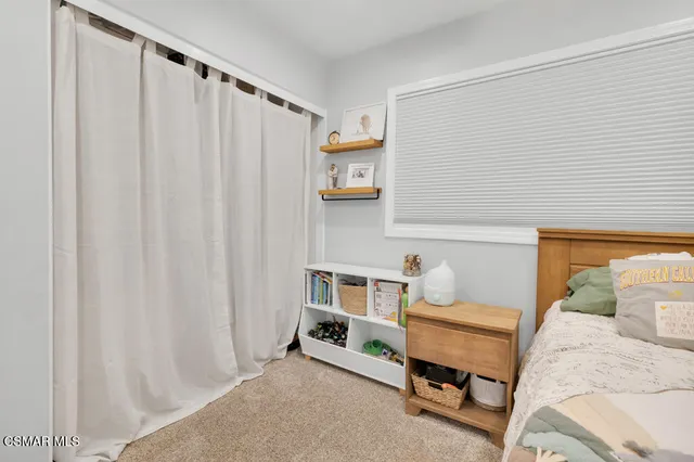a view of a dining room with furniture and window