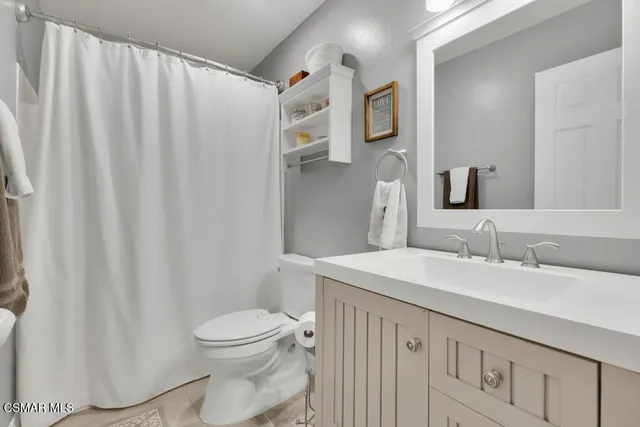 a view of a large mountain with mountains in the background