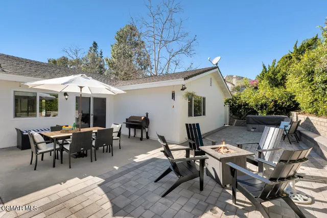 a kitchen with stainless steel appliances a refrigerator sink and wooden floor