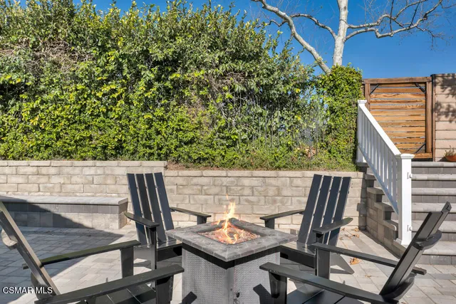a view of living room with furniture and wooden floor
