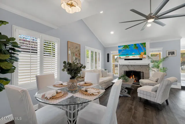 a dining room with furniture and wooden floor