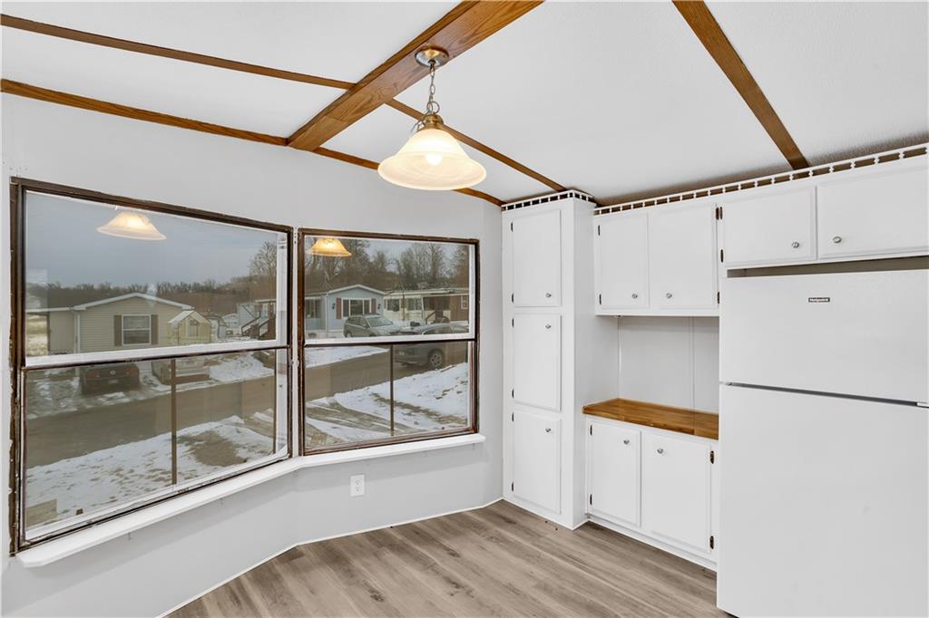111 Dancer Lane Jeannette, PA 15644 - Photo 13 of 26 a view of storage and utility room with wooden floor and windows